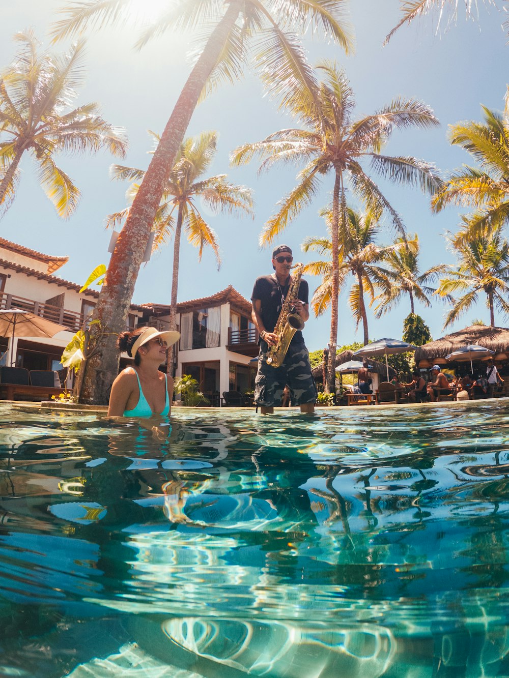 a man and woman in a pool