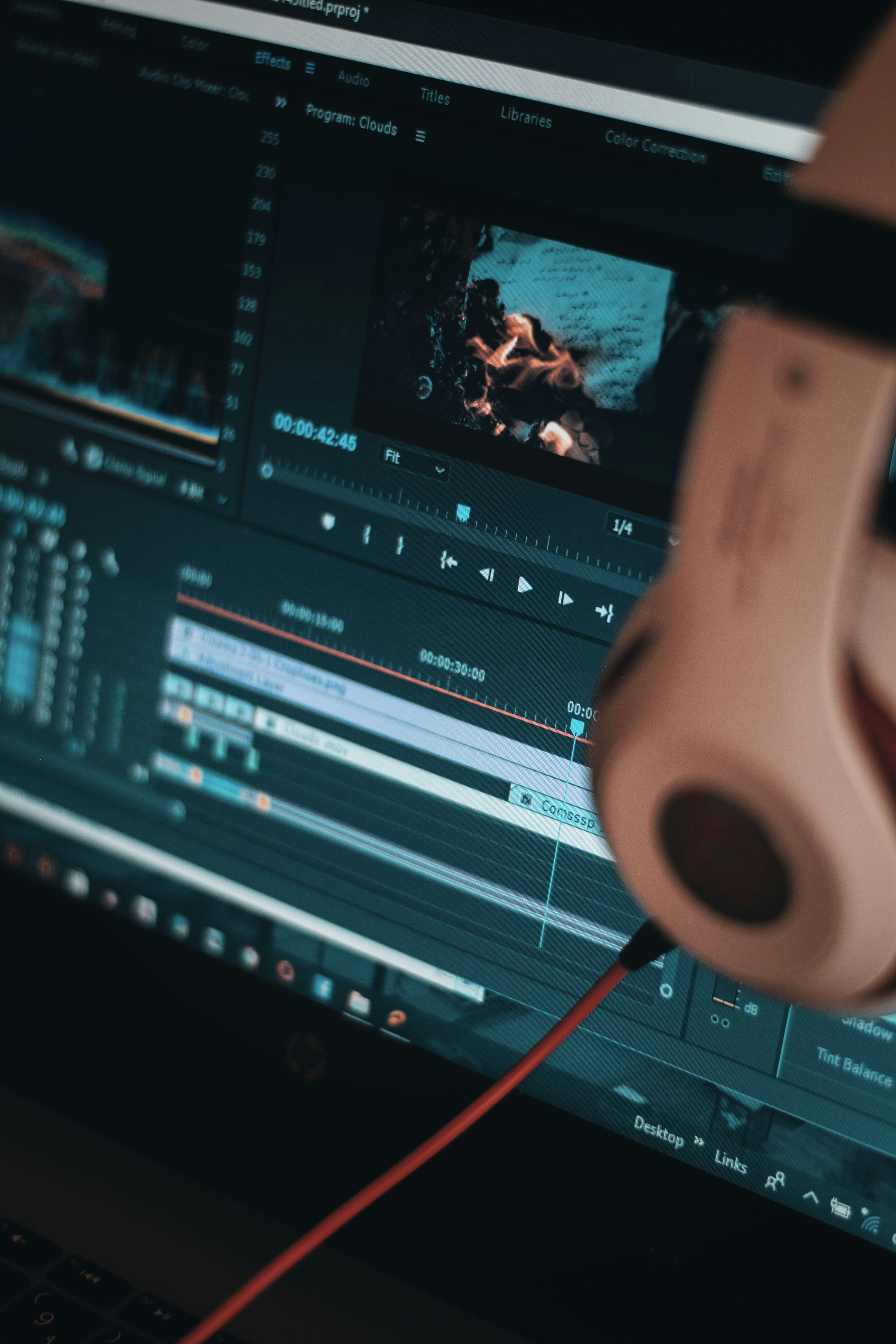 a person's hand on a computer screen