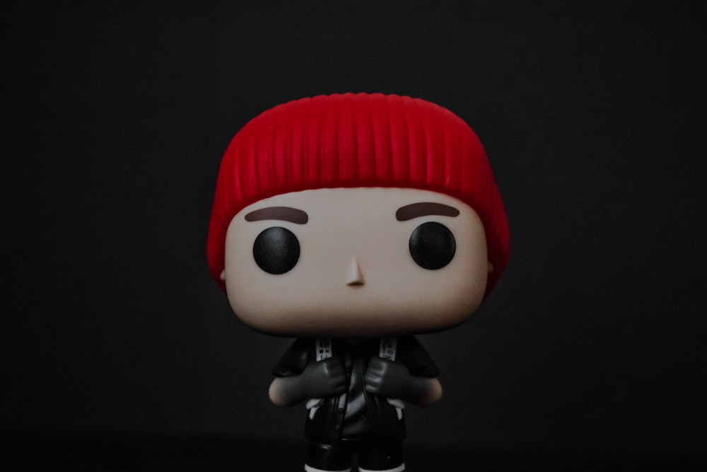 a toy doll with a red hat