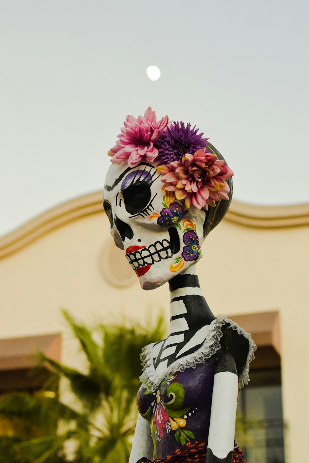 a person wearing a mask and holding flowers