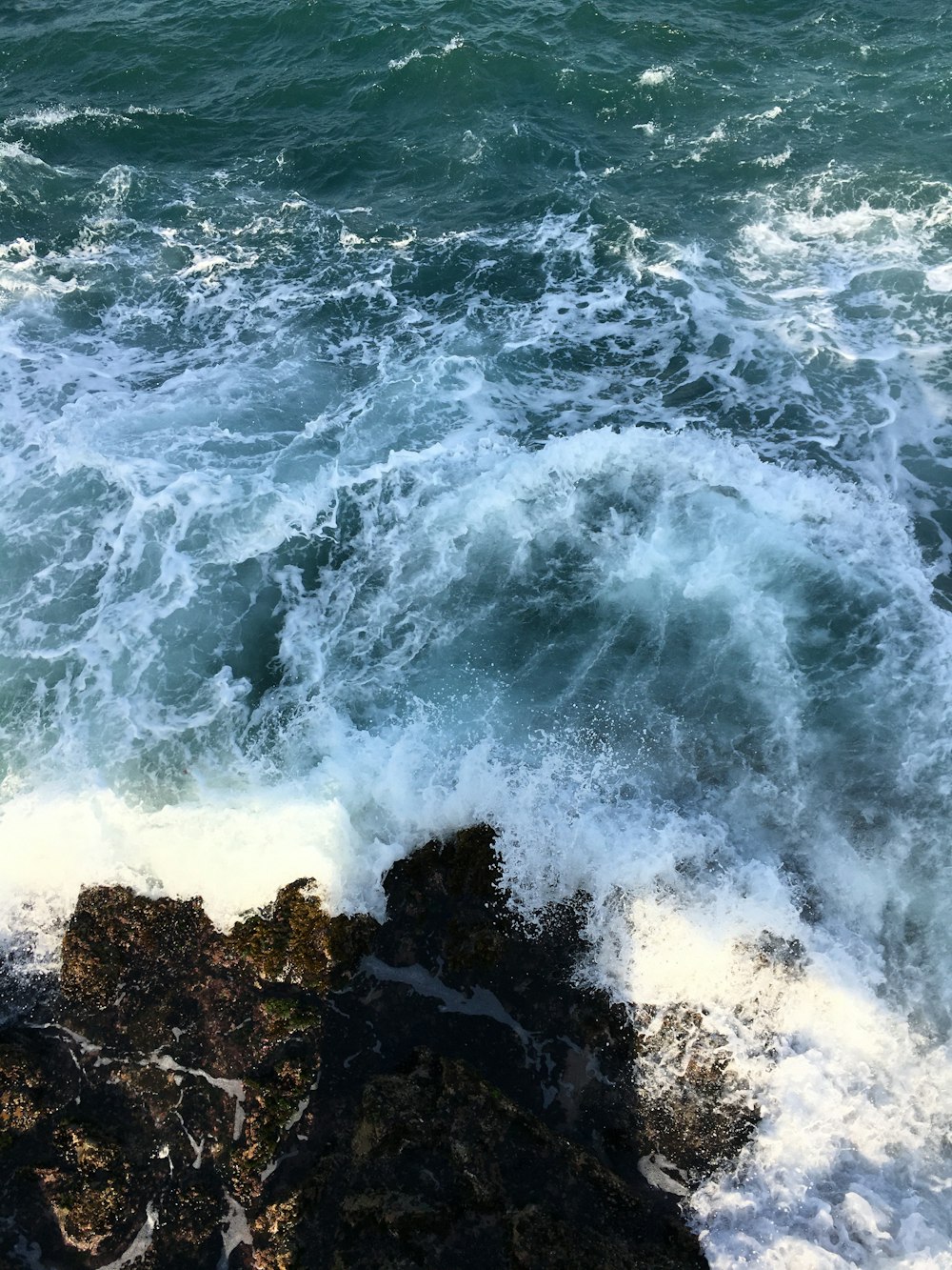 waves crashing on rocks