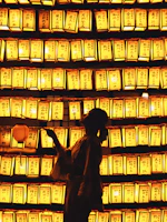 a person standing in front of a wall of lights