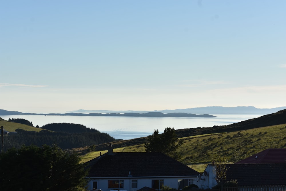 a house on a hill overlooking a body of water