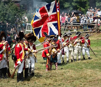 a group of people in uniform holding flags and a flag