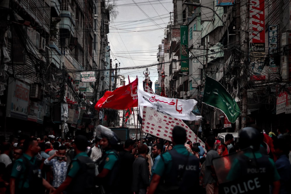 a crowd of people walking through a city