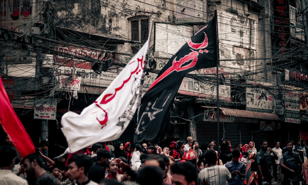 a crowd of people holding flags