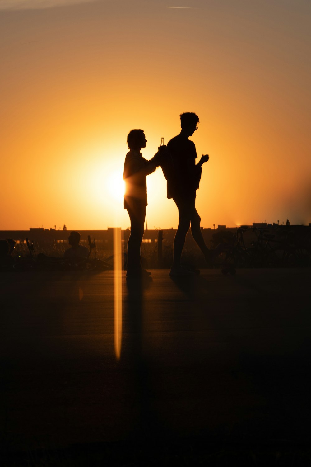 a silhouette of a couple of people