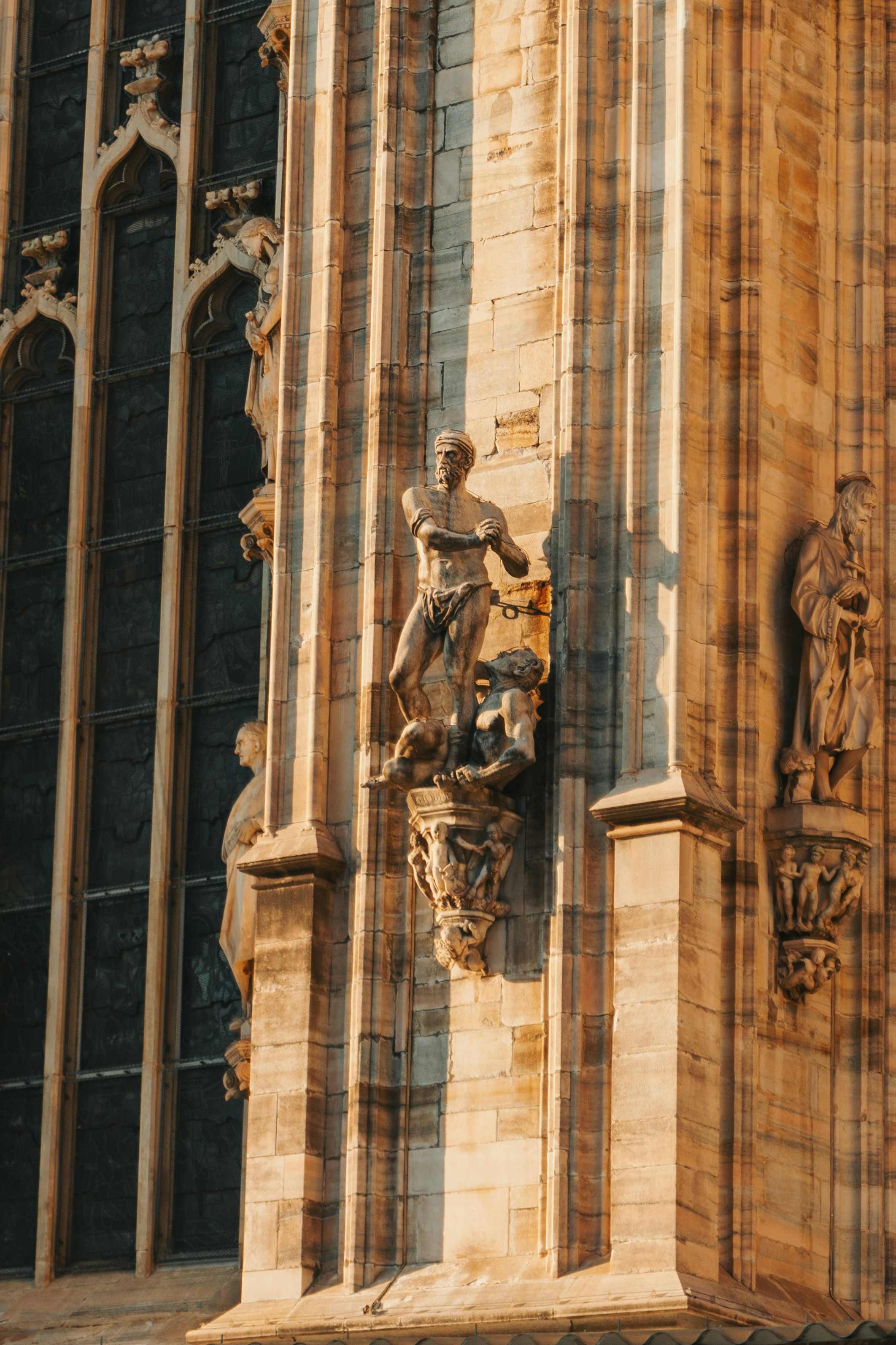 a statue of a person holding a staff