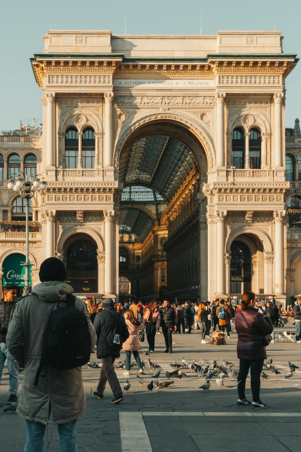 a large group of people outside Galleria Vittorio Emanuele II