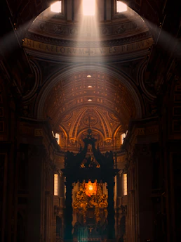Sunlight streaming through the ancient stained glass windows of Basilica di Sant'Anastasia al Palatino, illuminating the stone altar.