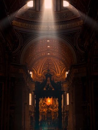 Sunlight streaming through church windows, illuminating the white, black, and orange decor.