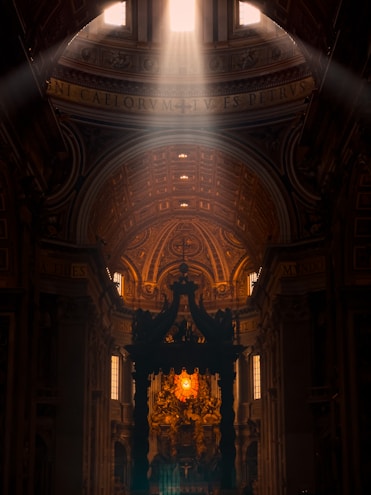 A choir singing in a sunlit church with stained glass windows casting colorful light.