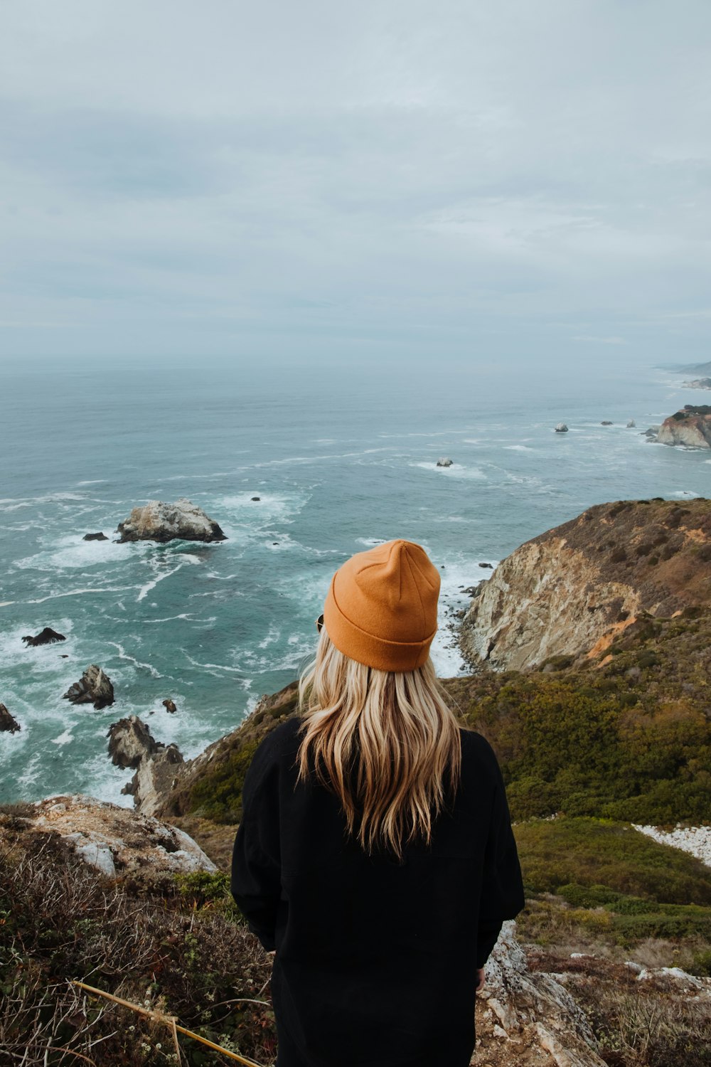 a person looking out over the ocean