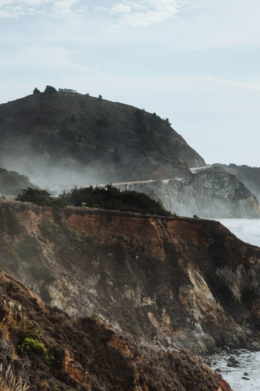 a cliff with a waterfall