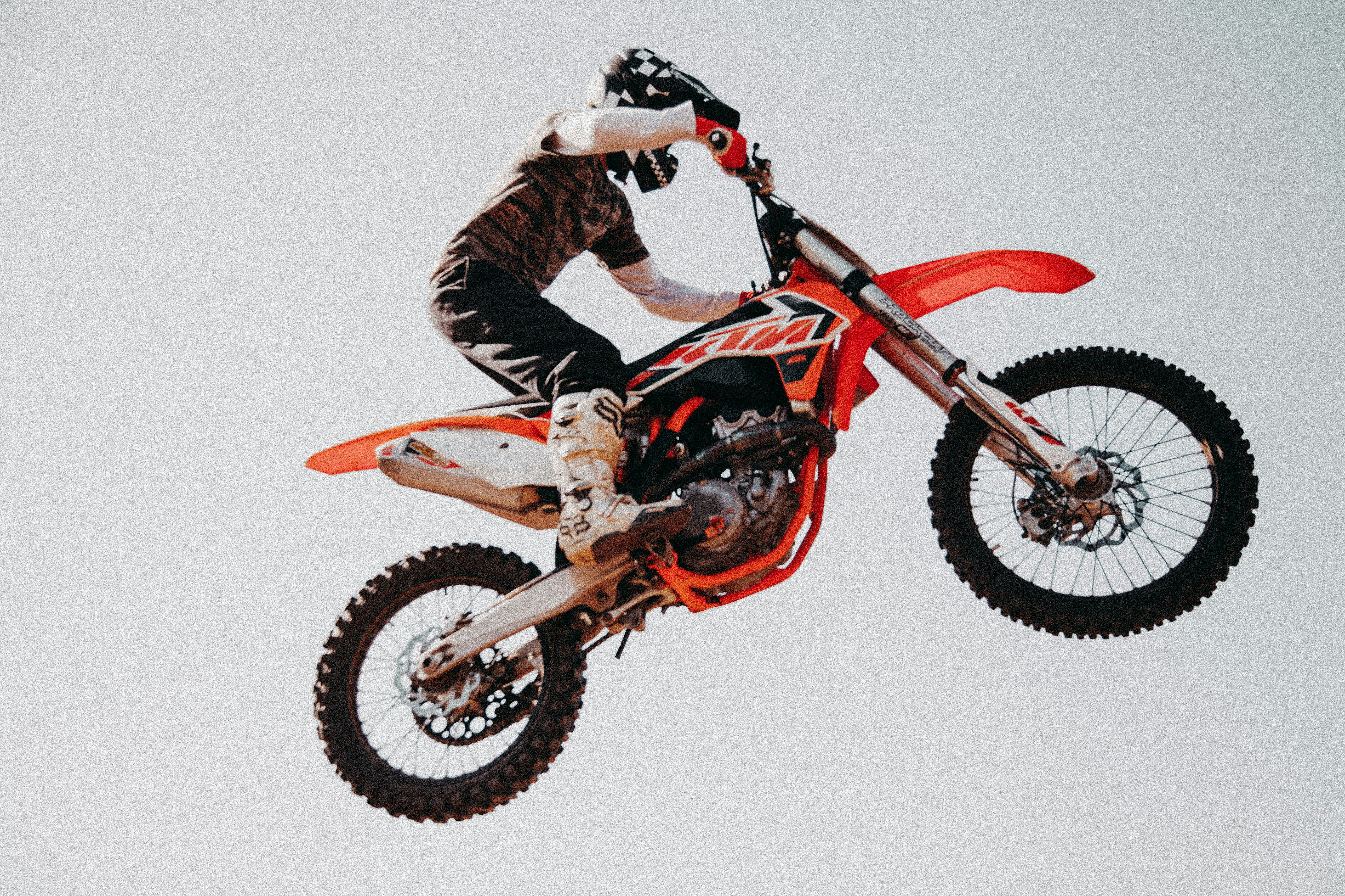 a man doing a trick on a motorcycle