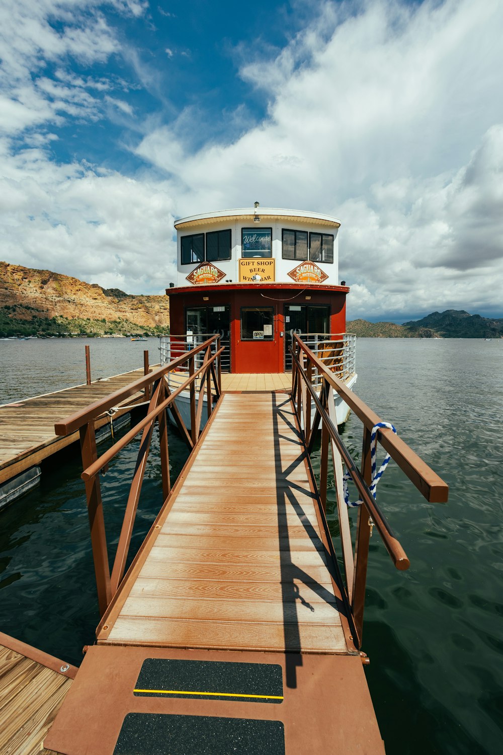 a wooden dock leading to a lighthouse