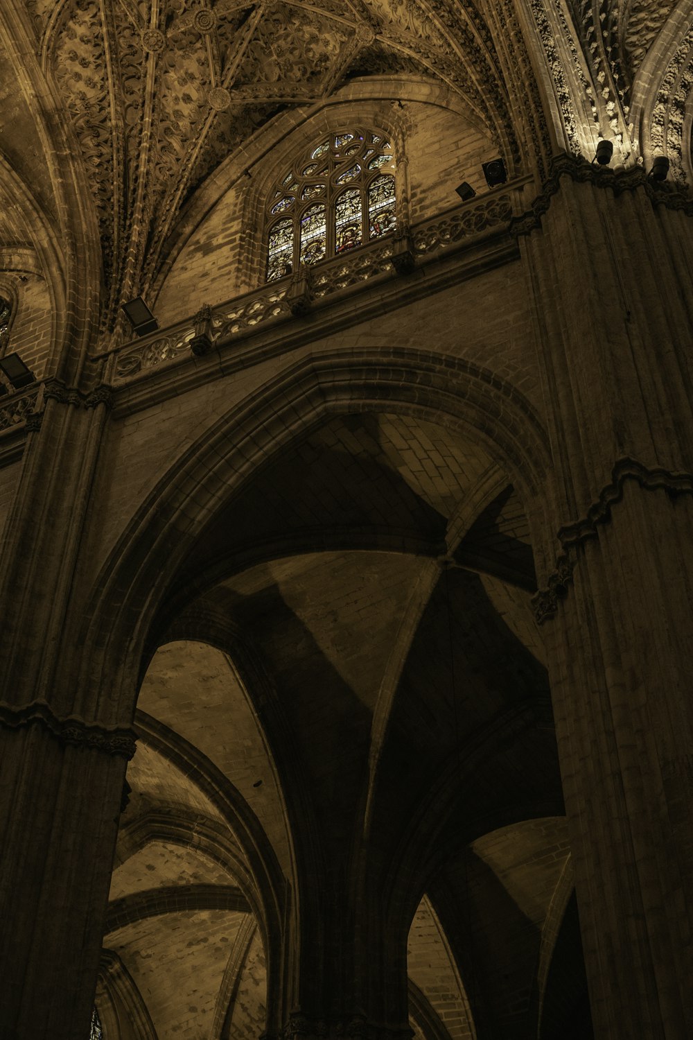 a large arched ceiling with a window