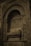 An intricately decorated stone tomb or sarcophagus set within an ornate architectural niche. The design features elaborate carvings, including floral and geometric patterns and detailed reliefs. The stonework is aged, giving it a historical and solemn appearance.