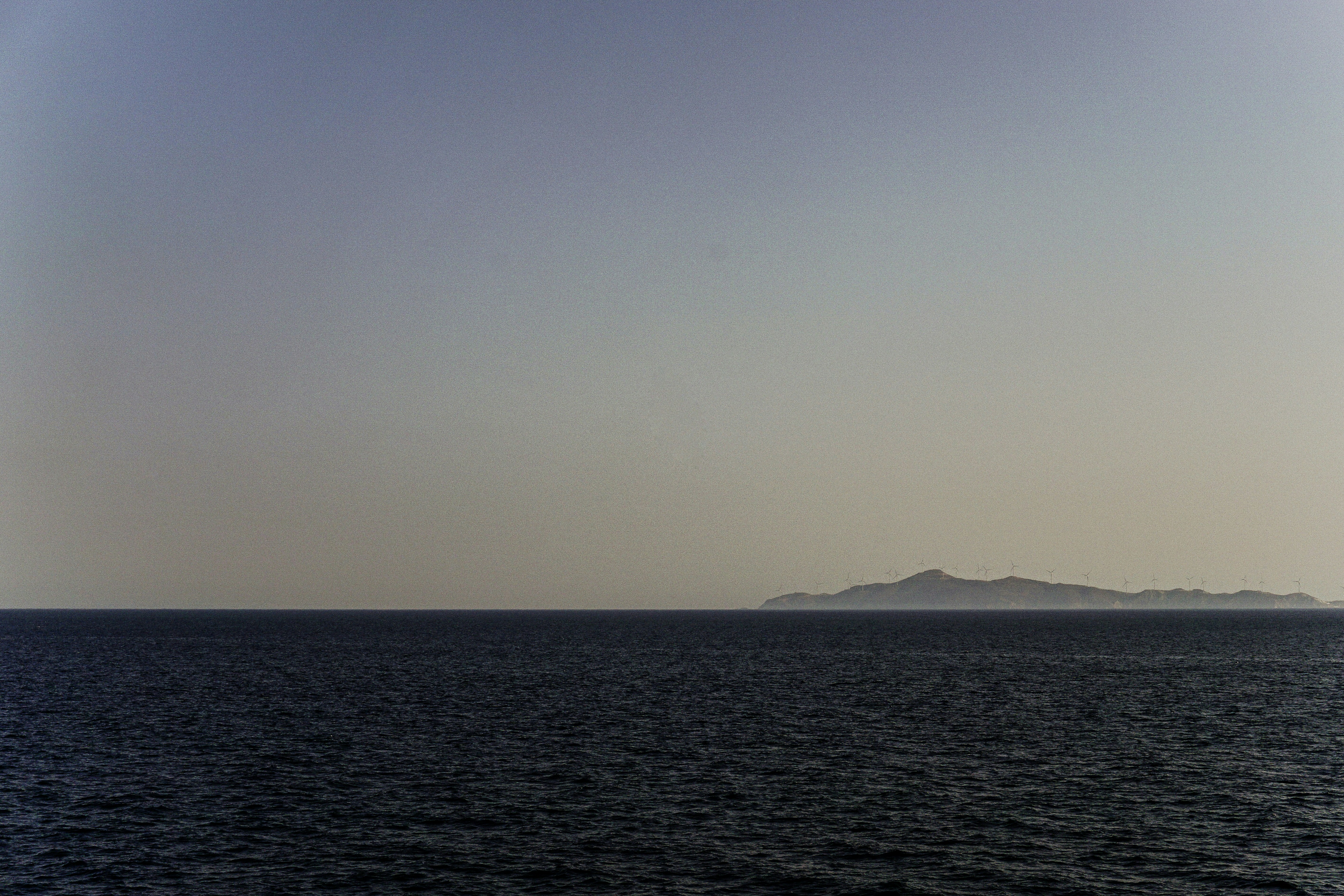 a body of water with a land in the distance