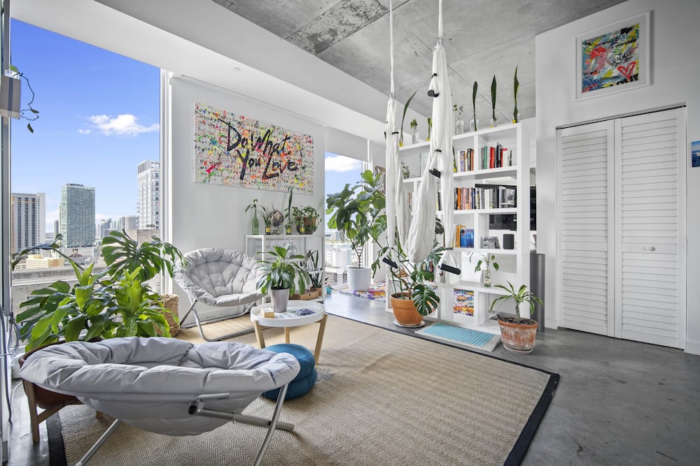 a room with a bookcase and chairs