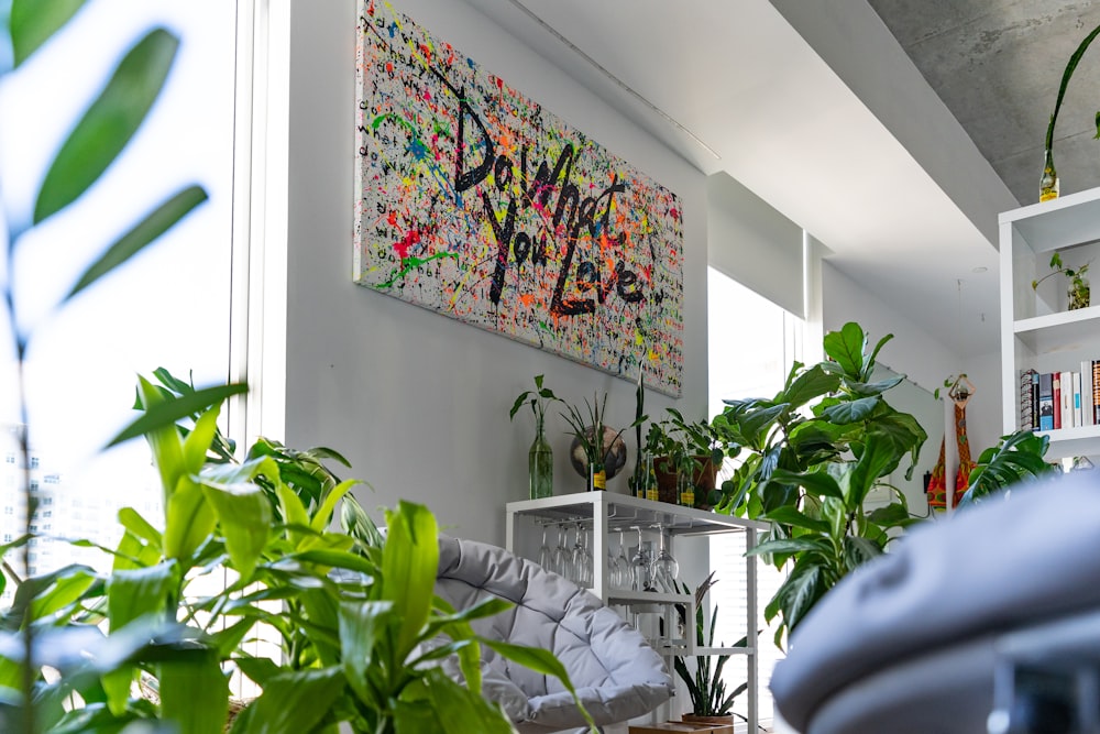 a room with a fireplace and plants