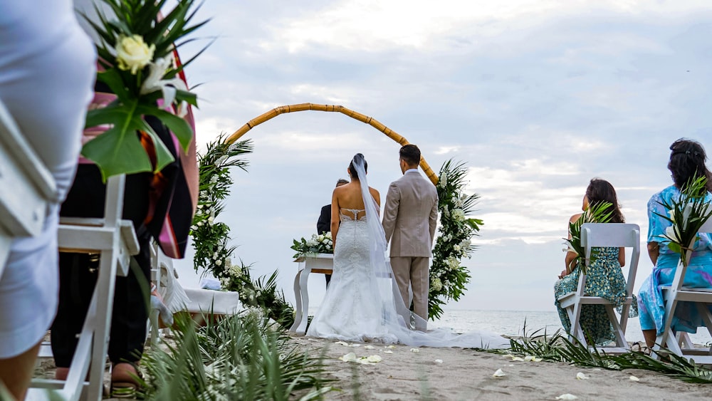 a bride and groom walking down the aisle