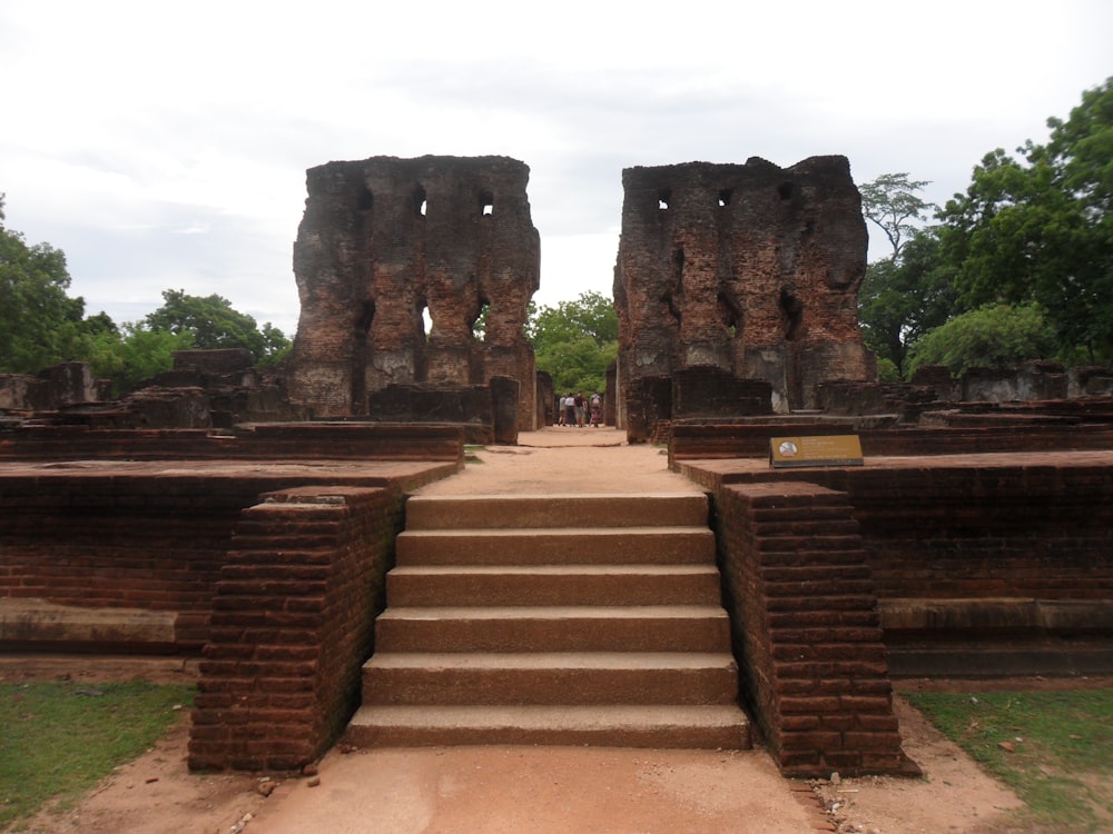 a stone staircase leading up to a stone structure