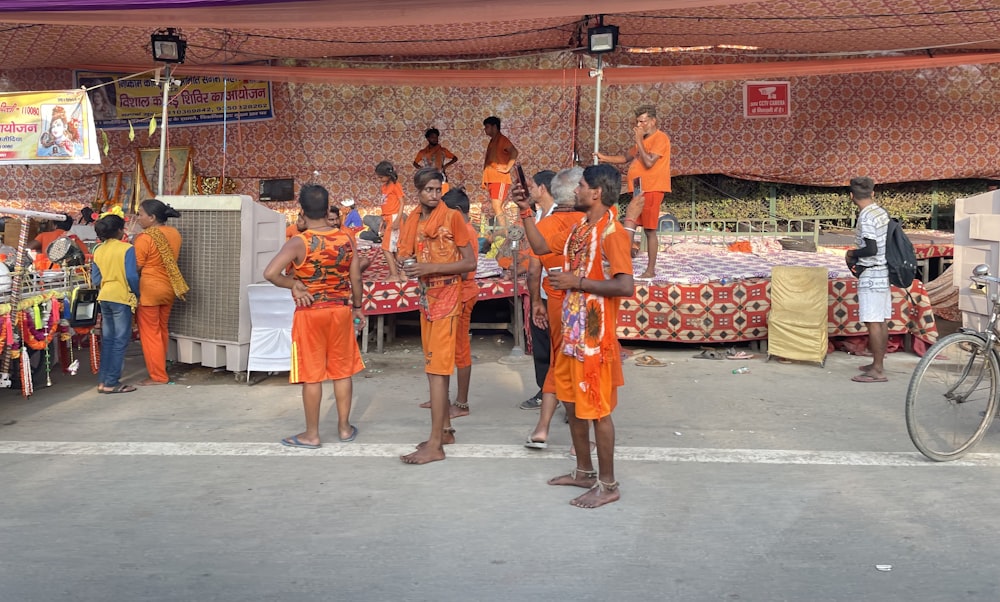 a group of people in orange robes