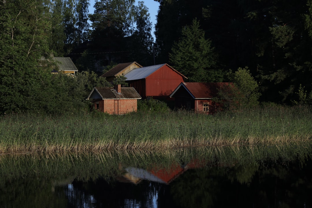 a group of buildings next to a body of water,