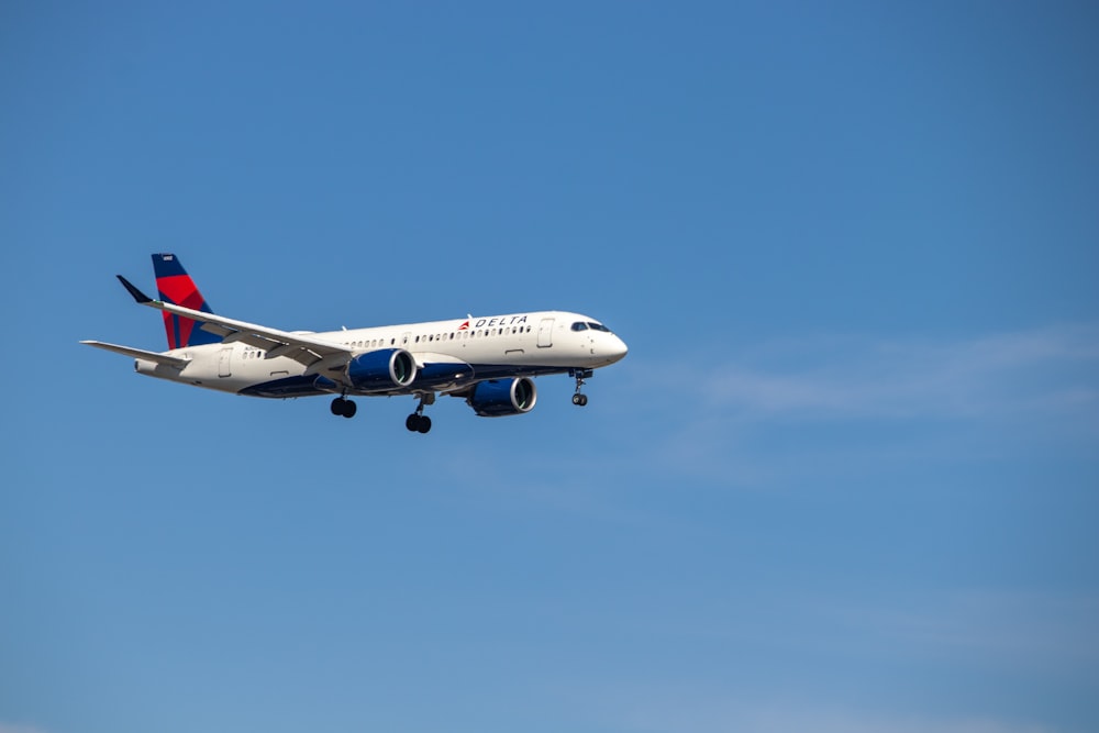 a large airplane flies through the air