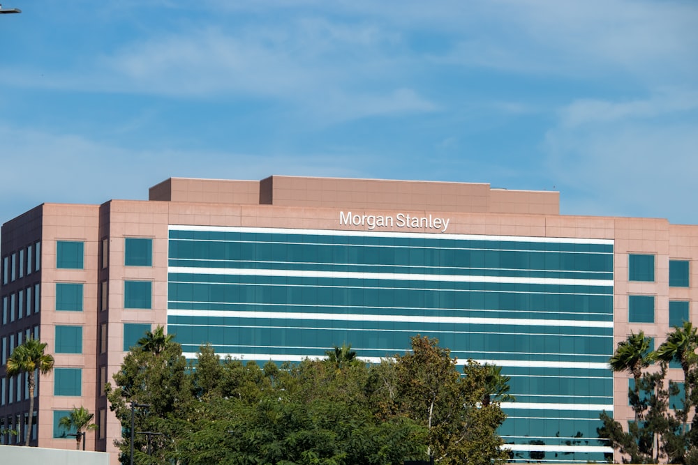 a large building with trees in front of it