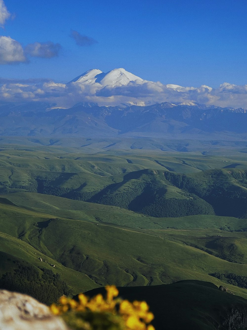 a mountain range with clouds