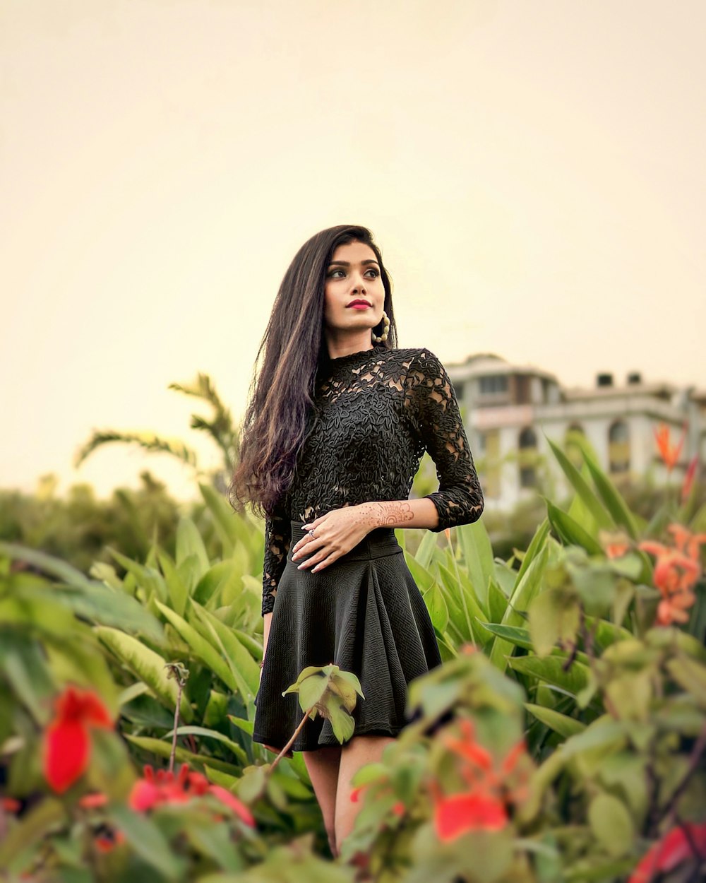 a woman posing in a garden