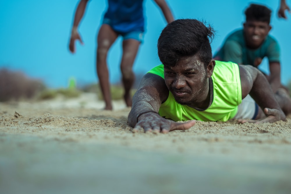 a boy playing in the sand