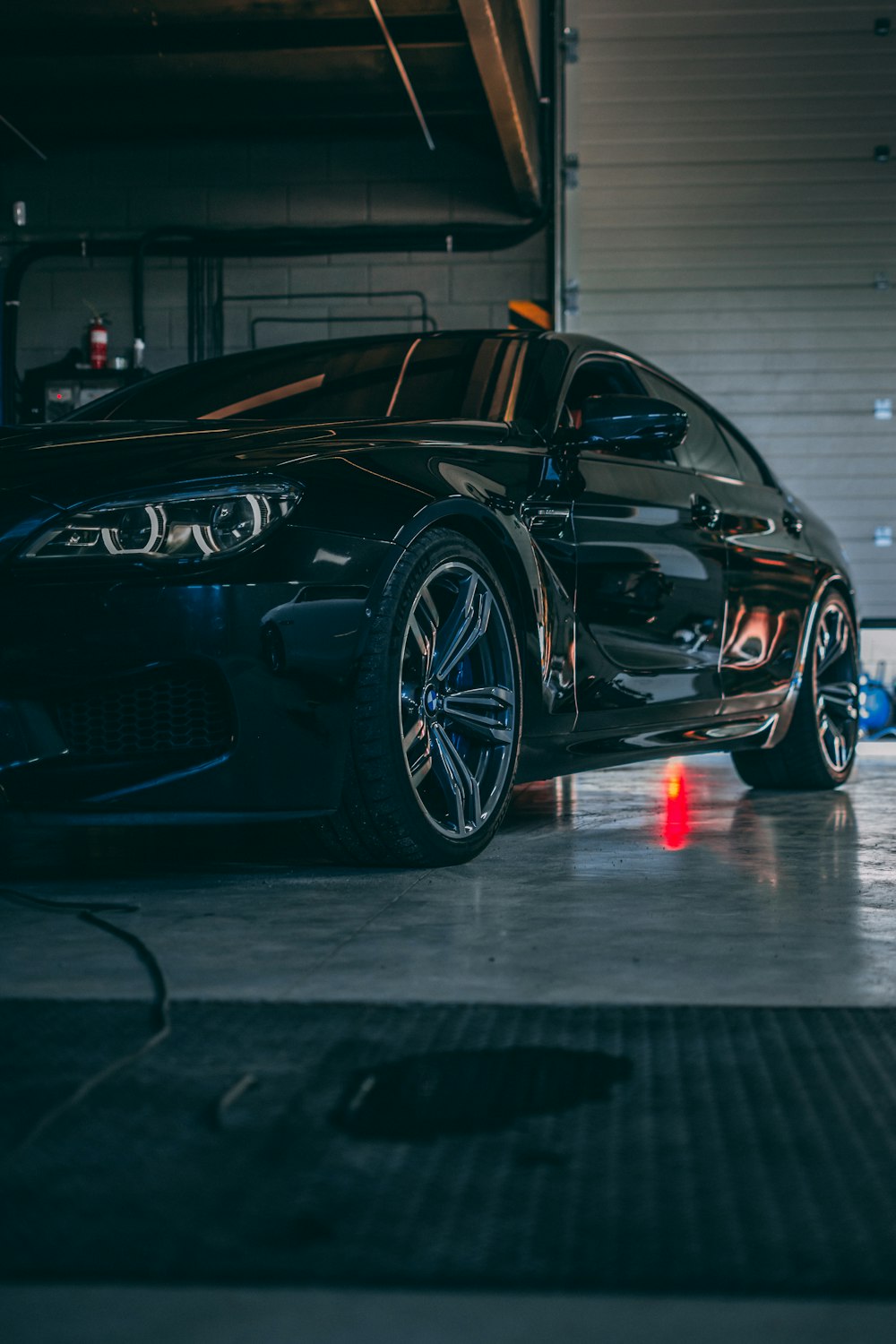 a black car parked in a garage