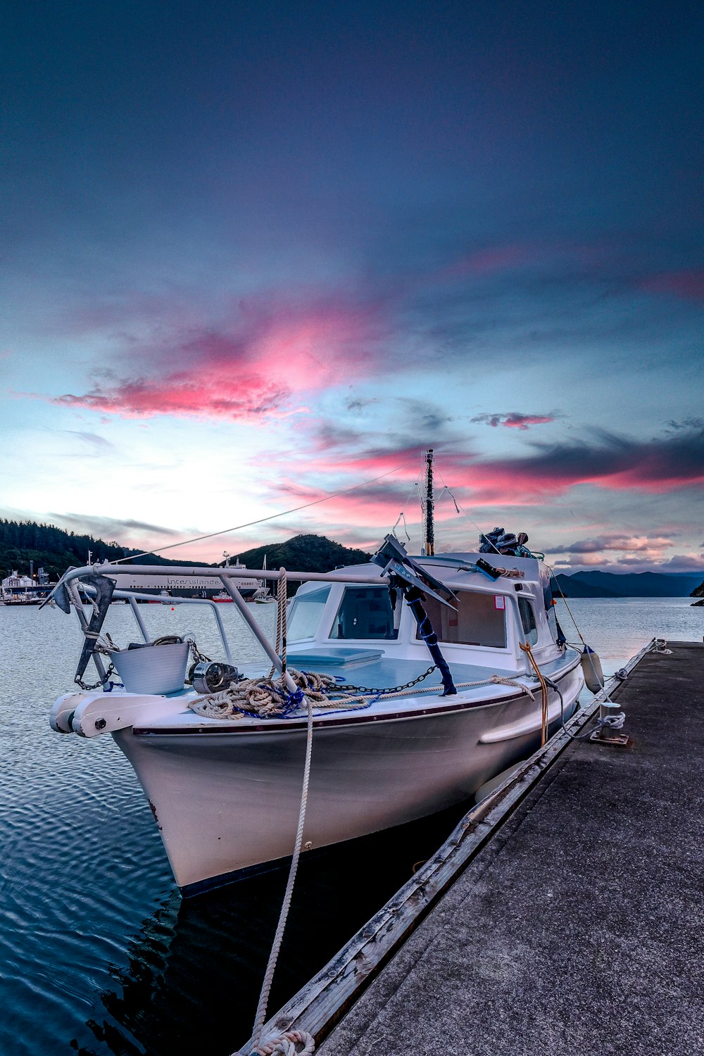 a boat is parked on the side of a dock