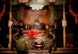 Golden incense smoke curling upwards in a quiet corner adorned with spiritual symbols.