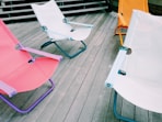 a table with a chair and a table with a chair and a table with a white tablecloth