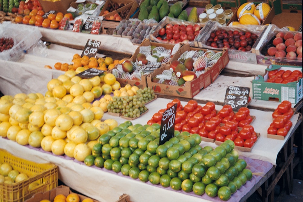 a bunch of fruits in a market