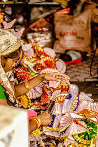 A lively workshop scene with participants crafting colorful handmade decorations.