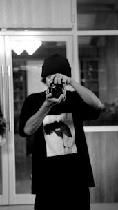 a person holding a camera