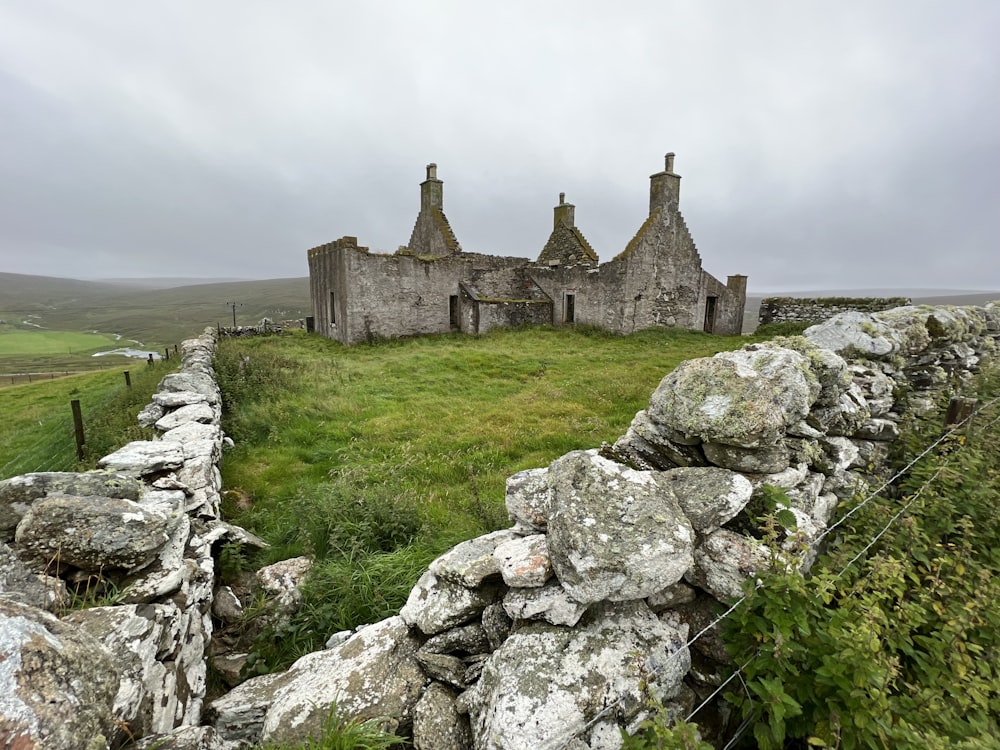 a stone castle on a hill