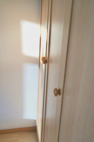 Cozy bedroom with modern wooden wardrobe and soft lighting highlighting craftsmanship