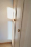 Wardrobe with integrated lighting and mirror panels designed for a 3 BHK home.