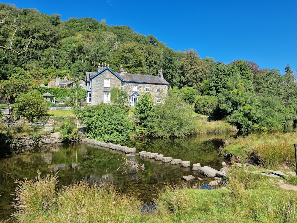 a house on a hill by a river