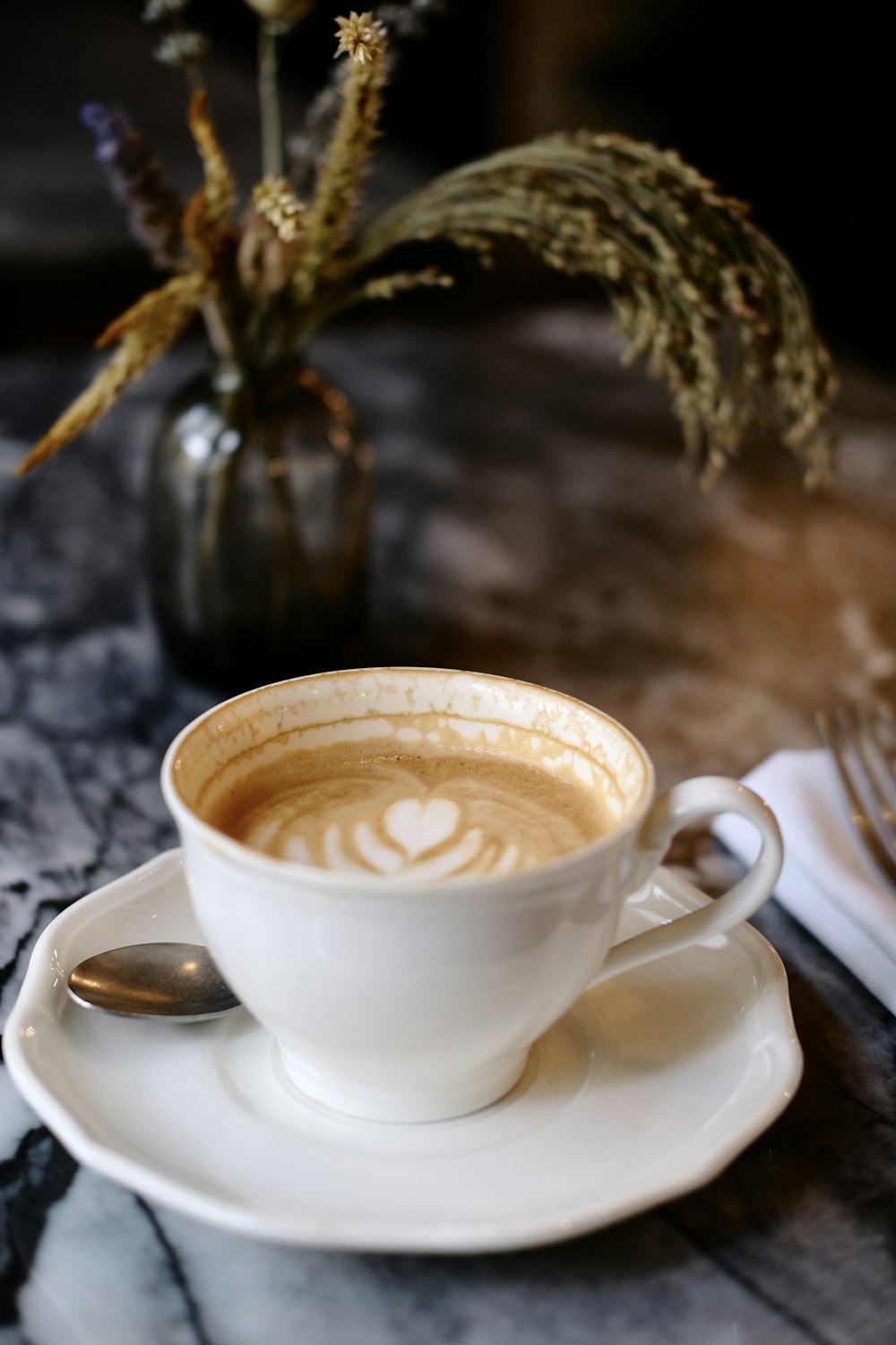 a cup of coffee on a saucer