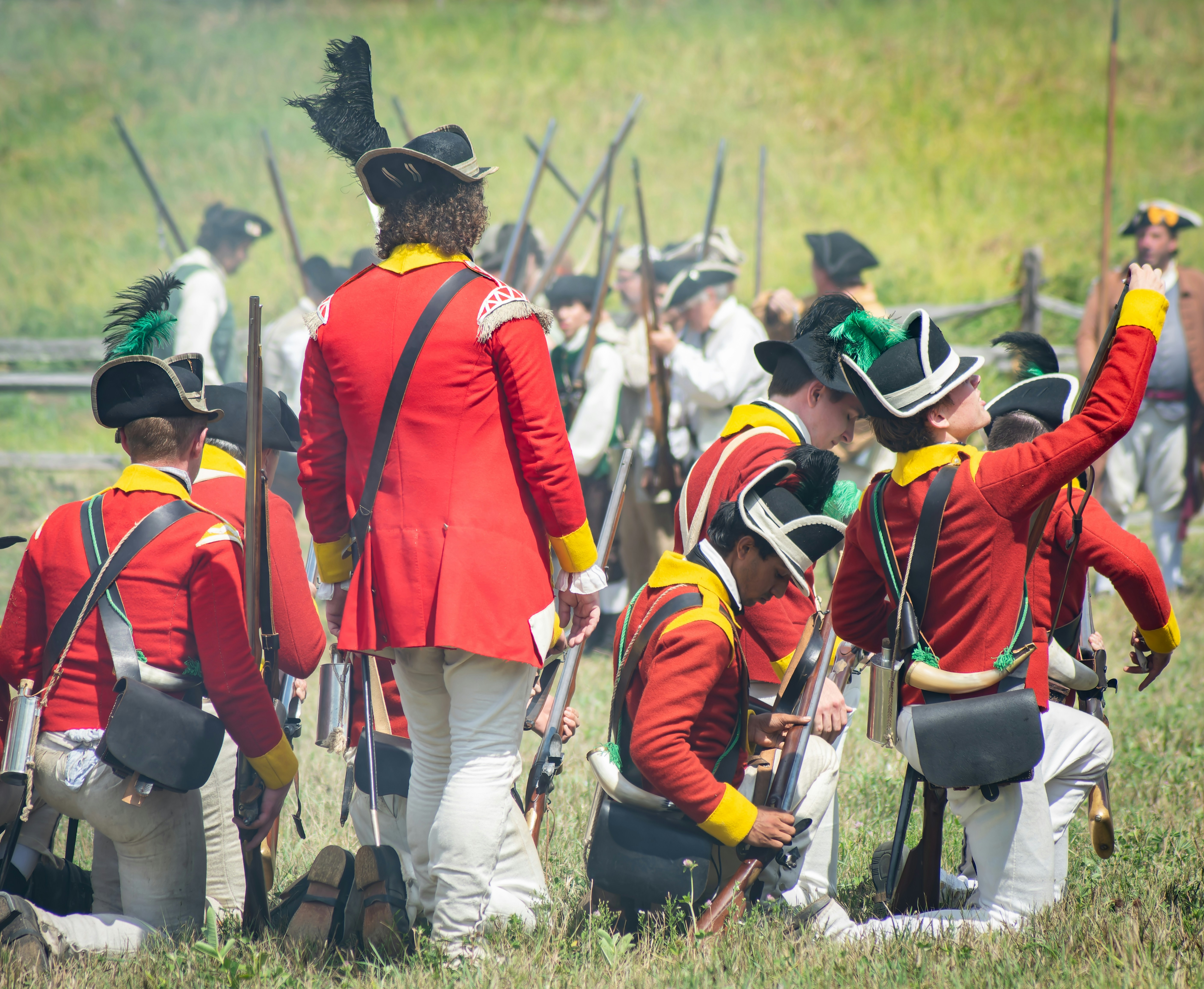 Reloading muskets in the open battlefield... mock battle (circa 1776, American Revolutionary War Reenactment at Old Sturbridge Village, Aug. 2022)