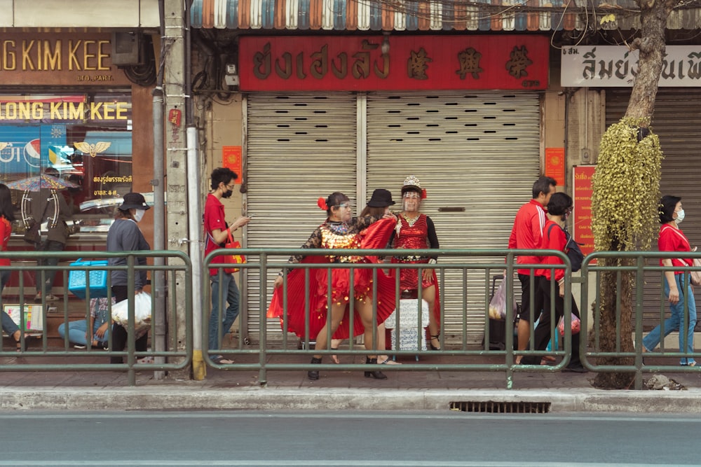 a group of people walking out of a store