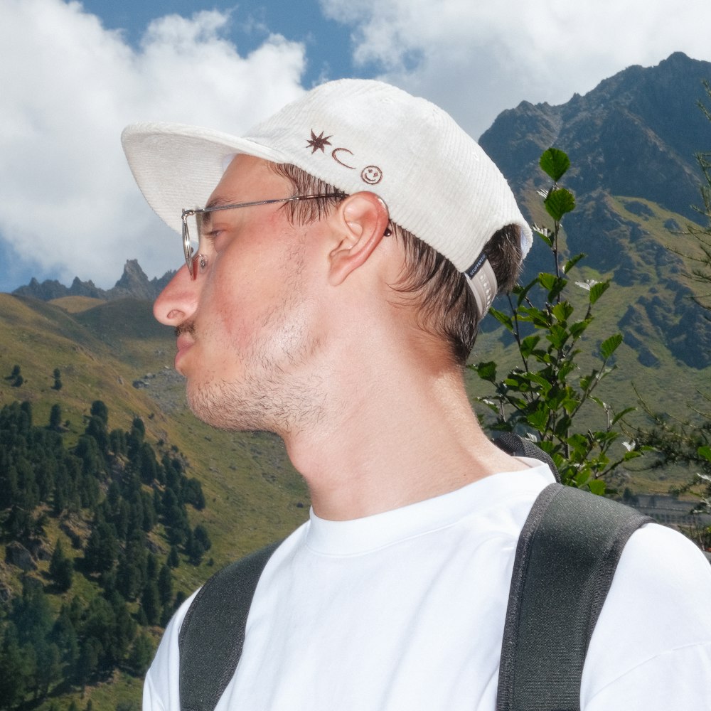 a man wearing a hat and glasses