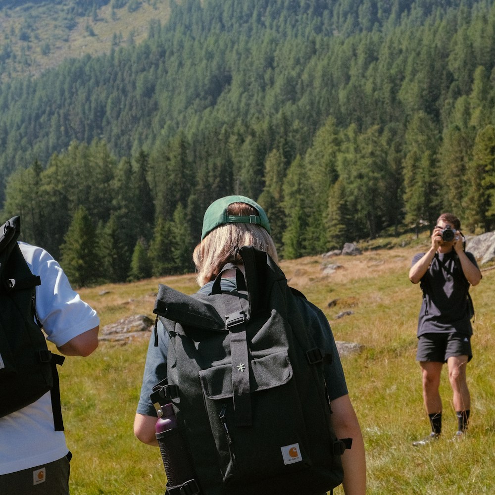 a man taking a picture of a woman with a camera